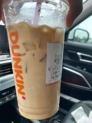 Iced coffee with cream and sugar and caramel swirl