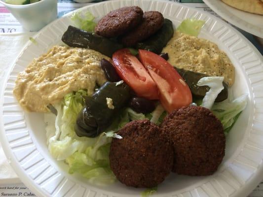 Trio of hummus, falafel, and grape leaves