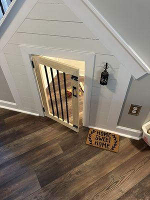 Built this dog house under the clients stairs complete with matching flooring, lighting and bead board walls! That's doggone special!