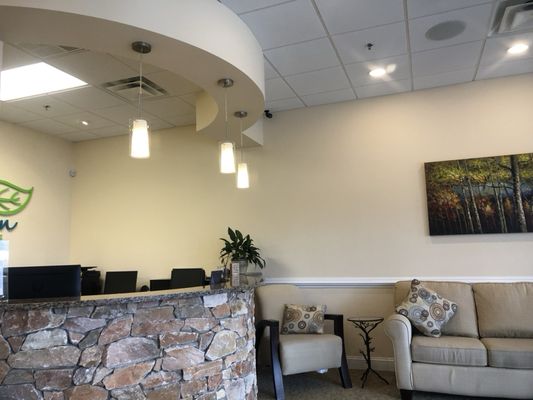 The reception area sets the mood with earth tones.