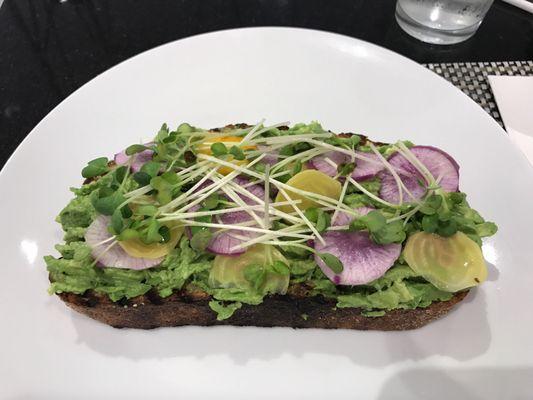 Amazing Avocado Toast with cured beets, radish, micro greens on a thick slice of wheat bread. Highly recommend!