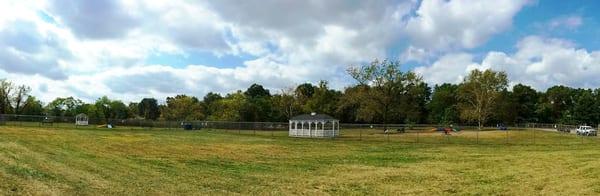 Panorama view of the small dog kennel on the left adjacent to the large dog kennel on the right.