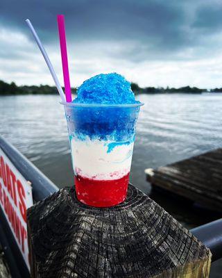 Cherry and blue raspberry shave ice with creamy vanilla soft serve