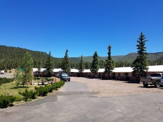 Front side of Sportsman Lodge beautiful pine trees