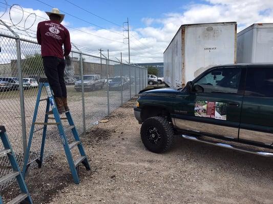 Chain link 8' tall with barb wire and razor wire