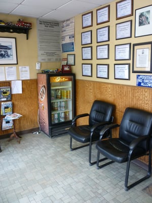 Waiting room lined with certification plaques for employees of New Fairfield Auto Repair & Towing.  Stop by or call for an appt.