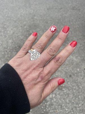 Gel manicure with flower design .