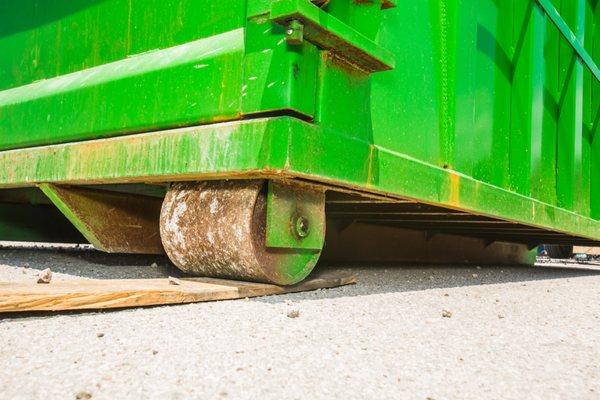 Moon dumpsters delivers our residential and commercial waste solutions on-time and safely with the use of boards for your property's safety.