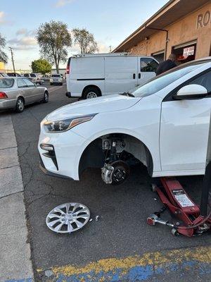 Fixing flat tire, even though we lost the wheel locks