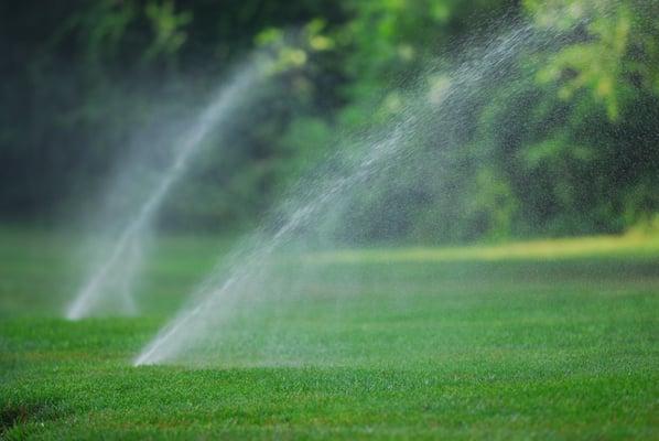 Underground sprinklers keep a lawn looking great all summer.