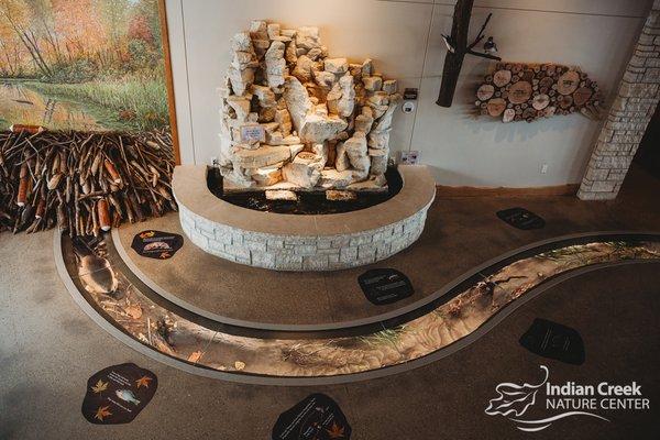 The in-floor Indian Creek Exhibit allows visitors of all ages and abilities to see the beneath the surface of our namesake, Indian Creek.