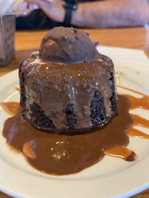 Sweet tooth Delight! Chocolate covered Lava cake with a scoop of vanilla ice cream covered in chocolate and a drizzle of caramel!