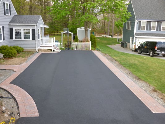 new driveway with paver border