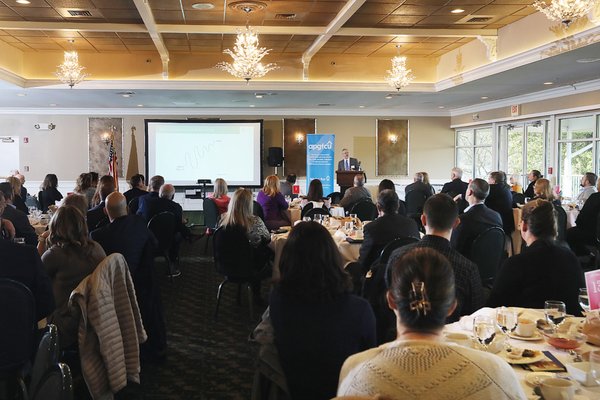 Advisor Rick Fletcher addresses the Harford Chamber with market updates.