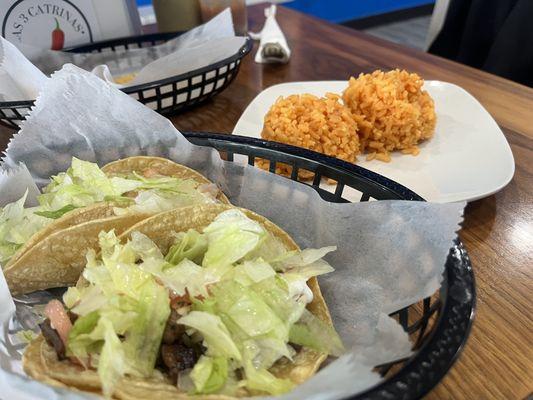 Carne Asada Taco and Al Pastor, side of rice.