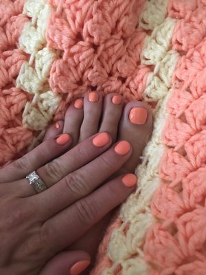 Beautiful mani pedi she took the time to match the color perfectly.