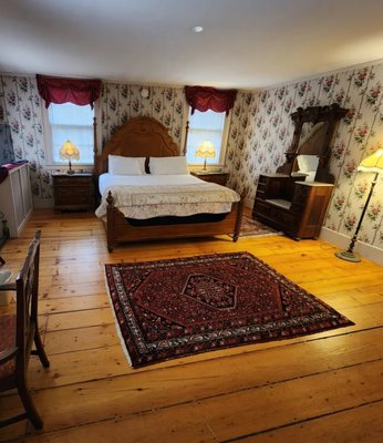 Pamela's Suite, king bed, sitting area with fireplace.