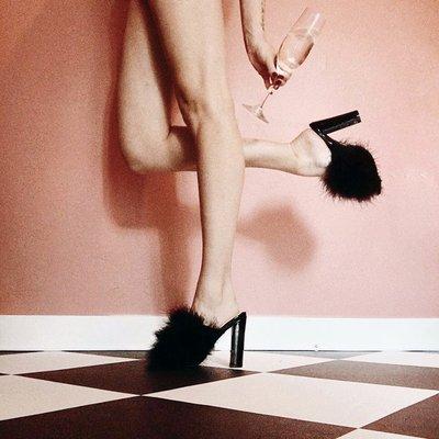 Who doesn't need a pair of feathery mules? Shoes available at Le Bel Age Boutique. MODEL & PHOTO: @pourstyles