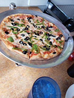 Small pizza, $17, toppings are $3 each (handful of olives and green pepper slivers)