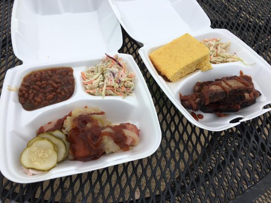 Sausage with homemade pickles, beans and slaw along with brisket cornbread and slaw. Amazing lemon BBQ sauce.