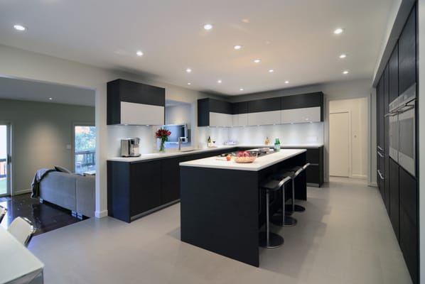 Contemporary Kitchen.  Large Format Porcelain Tile, Dark Cabinets, Quartz Top.