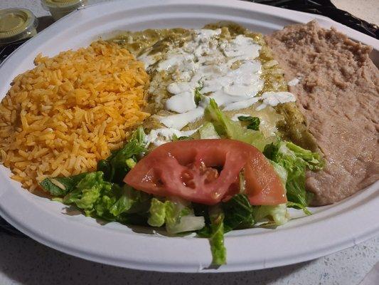 Cheese enchilada plate with refried beans, rice, and salad.