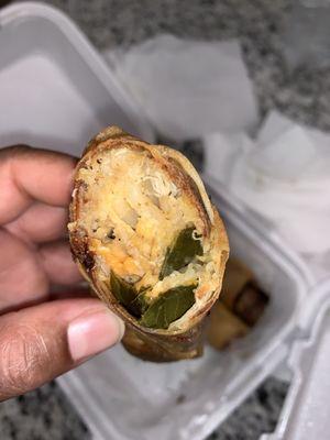 Inside of the amazing soul rolls (deep fried Mac and cheese, dressing, greens and yams)