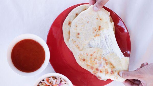 Choose from over a dozen filling choices for our cheese-oozing, toasted-edges pupusas.