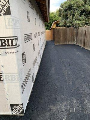 New asphalt all the way back to the back yard!