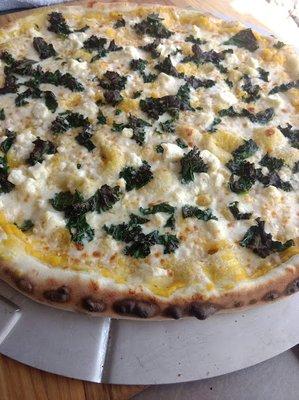 Harvest, our own creation with an olive oil base instead of red sauce, Butternut Squash puree with feta cheese kale and mozzarella.