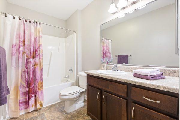 Large bathrooms with wide vanities.