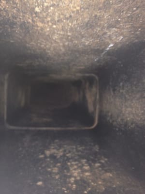 Inside of a chimney, see the flue tile? The spots within the black? That's called spalling and the deterioration of the flue.