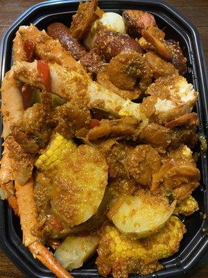 Seafood Tray with Lobster, Shrimp, Crab, Potato, eggs, & Corn.