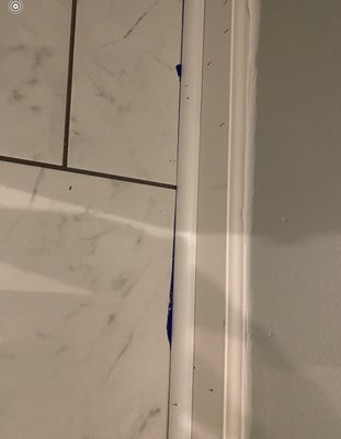 Painters tape that was left on the floor covered up