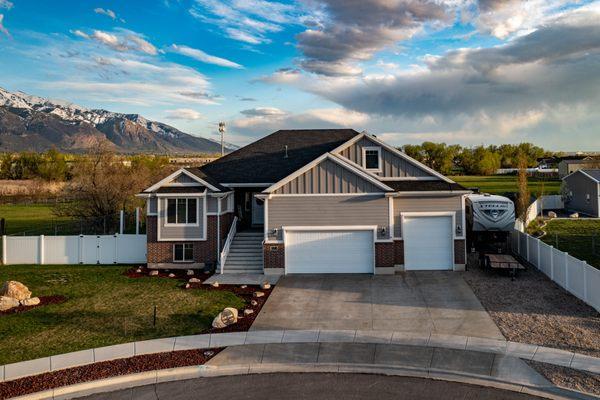 This home is in Harrisville Utah and has 5 beds, 3 baths, and a 4 car garage!