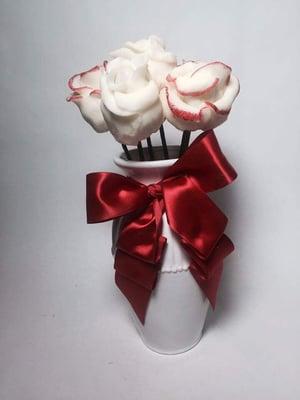 Rose cake pops or strawberries.