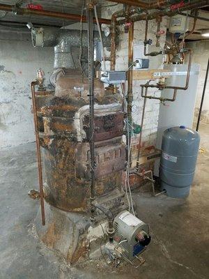 We remove these 100 year old boilers on a weekly basis and replace them with highly efficient new boilers