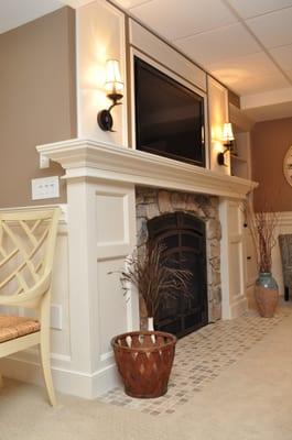 Basement Gas Fireplace with stone surround and custom mantle.