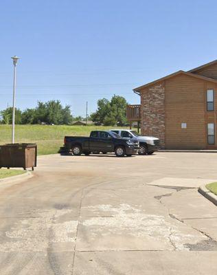 The outside of Apartment 21 where I used to live and my truck