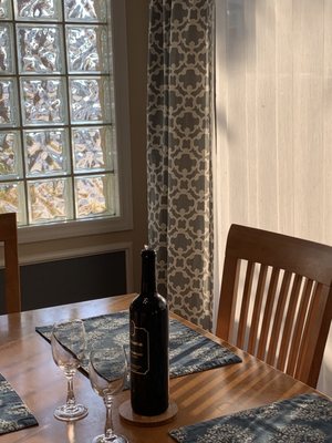 Dining room table with a bottle of red wine from the same Sebastian winery