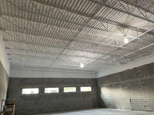 Areas in the building where Compass Insulation installed white K-13 sprayed acoustic insulation.