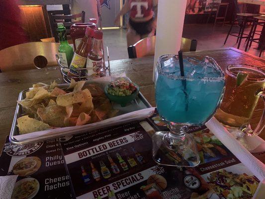 Blue margarita and chips, guac