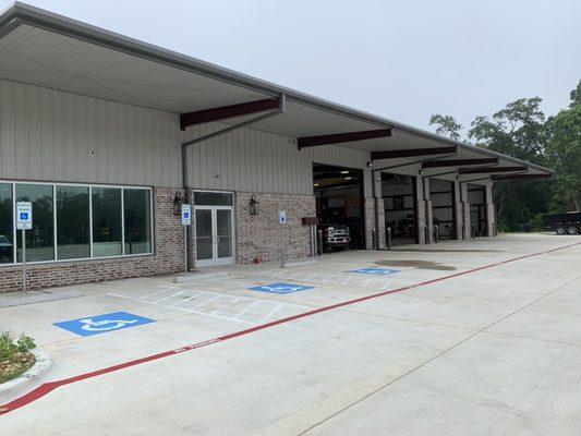 Side view of the business (main entrance in from side), as well as our employees- work bays.