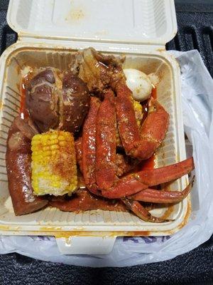 1 lb of snow crab legs with an extra corn and an egg. (Two clusters) Believe me.. it's more than enough! I was stuffed!! Soo good!