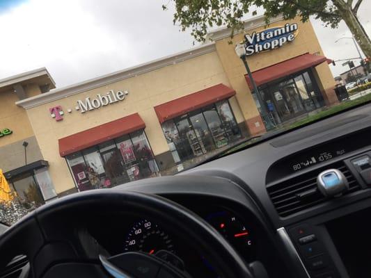 Pictures of customers waiting in the rain for store to open...store was due to open at 10:30.. It's is now 10:56