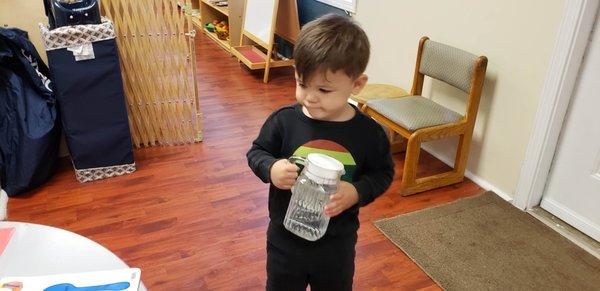 2.5 yrs old is getting ready to set up the lunch table.