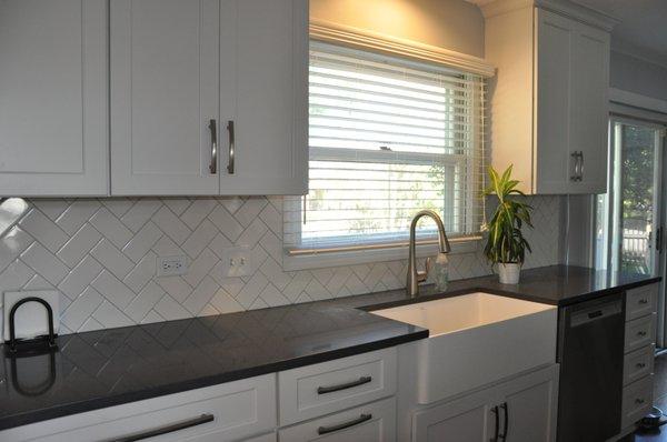 Spot the backsplash and deep farm sink.