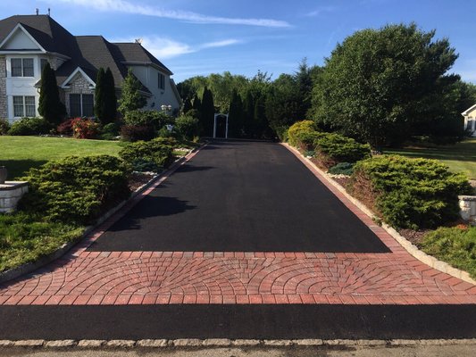 Driveway replacement with a paver stone apron and border in South Brunswick, NJ.