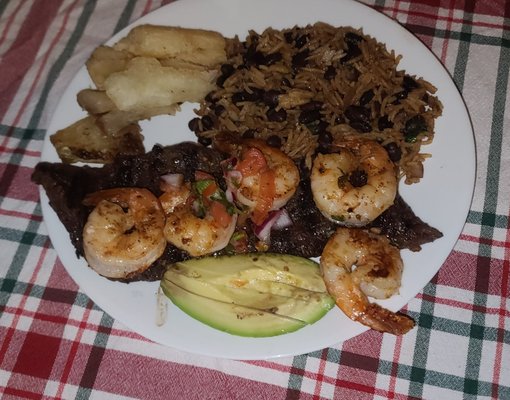 Surf and Turf  (flavorful combination of grilled skirt steak and shrimp, fried yuca, and a mix of rice and beans)