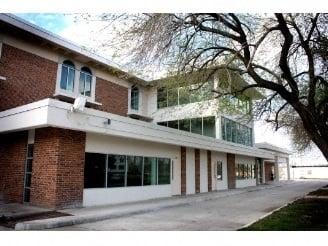 Exterior shot of the building where salon is located. Formerly Jones Elementary.